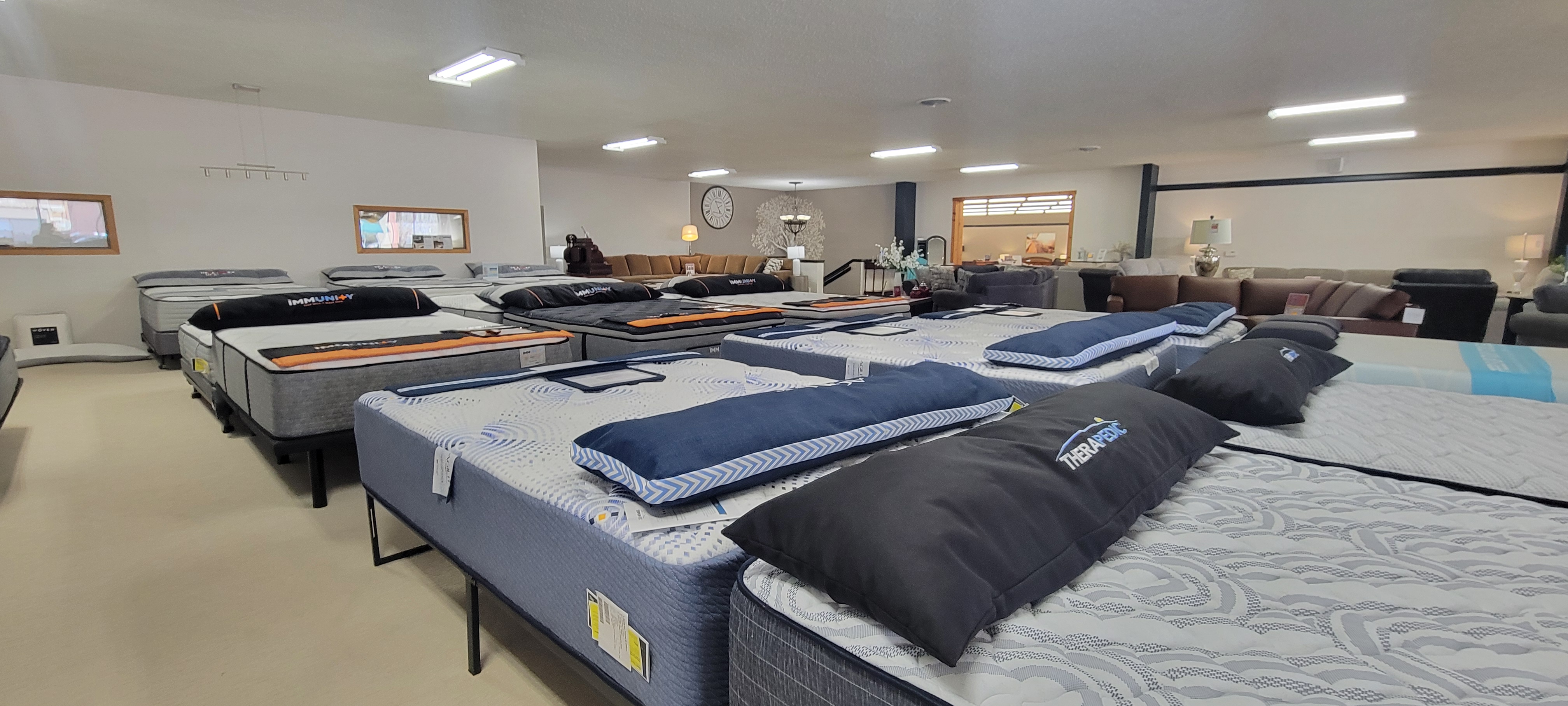 Mattress floor with sofas visible in background